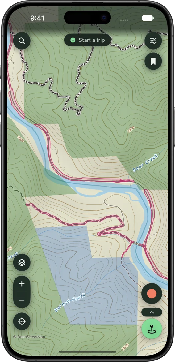 SK Maps on-device topo base along a river canyon showing labeled contour lines, a numbered MVUM road, public land shaded by agency, named creeks, and the river road outlined where it crosses private land on recorded access easements
